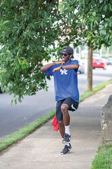 Tayvho dancing on the sidewalk