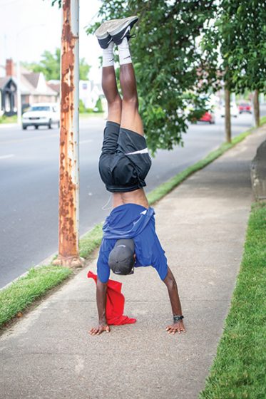 Tayvho doing a headstand