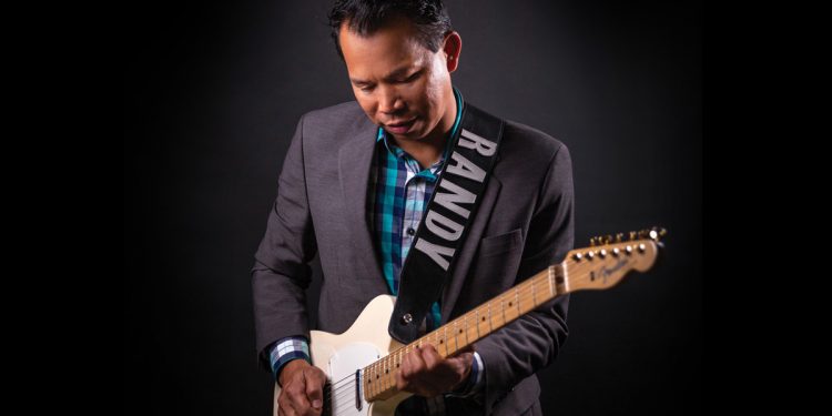 Randy Banas playing the guitar