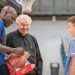 Tony Delk signs basketball for kid with Father Ed Bradley
