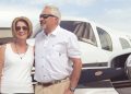 Susan and Ray Assmar in front of their Beechcraft Duke airplane