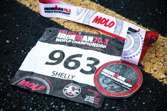 Shelly Hammons' Ironman 70.3 World Championship bib number and medal