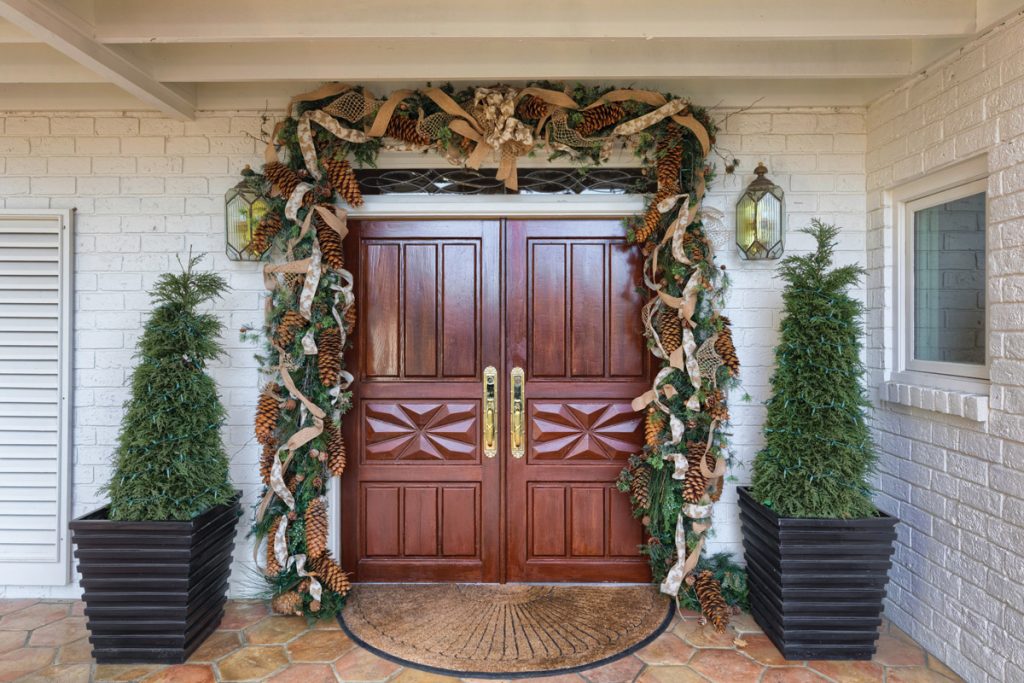 Front doors of home decorated for Christmas