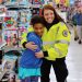 Girl and EMT Worker during Shop With a Cop