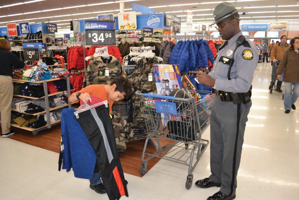 Boy and State Trooper during Shop With a Cop