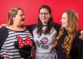 Eva Cash, Jessica Gillum, and Joy Beth Whitmer pose together wearing Minnie Mouse ears