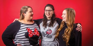 Eva Cash, Jessica Gillum, and Joy Beth Whitmer pose together wearing Minnie Mouse ears