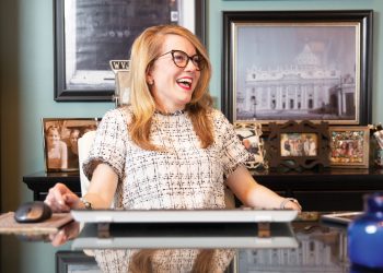 Interior Designer Laura Ruth Edge sitting at her desk