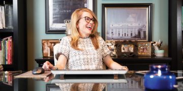 Interior Designer Laura Ruth Edge sitting at her desk