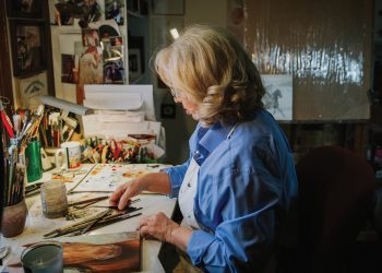 Artist Rhonda McEnroe working in her studio