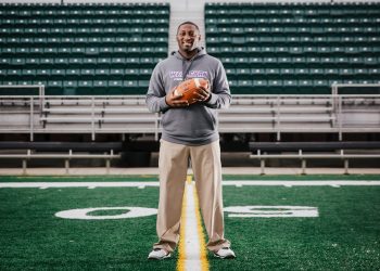 Kentucky Wesleyan College Head Football Coach Craig Yeast standing on football field
