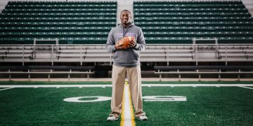 Kentucky Wesleyan College Head Football Coach Craig Yeast standing on football field