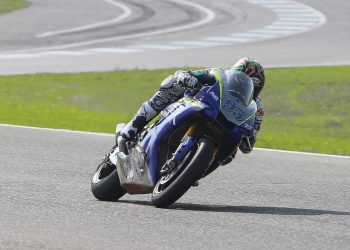 Motorcycle racer Jake Lewis on his bike