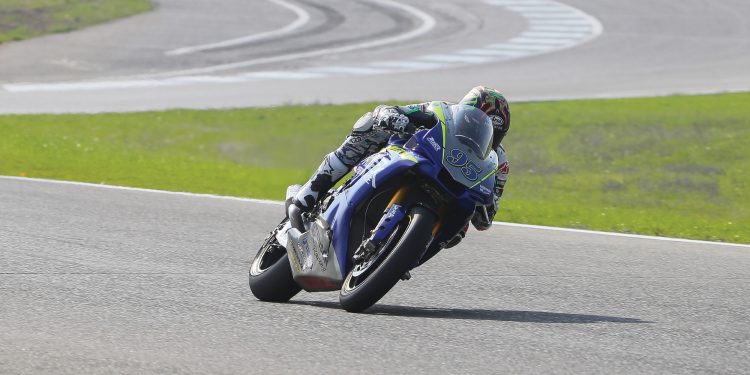 Motorcycle racer Jake Lewis on his bike