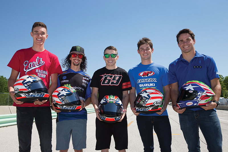 (L-R) Jake Lewis, JD Beach, Roger Hayden, Nick McFadden, and Hayden Gillim hold their Nicky Hayden replica helmets which they all wore in tribute to Nicky during the 2017 Road America race in Elkhart Lake, Wisconsin. Photo by Brian J. Nelson.