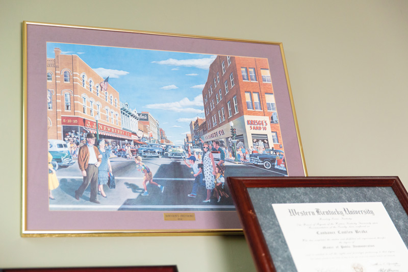 1954 painting of downtown Owensboro hang on display in Brake's office.