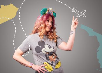 Melissa Boarman, certified travel agent, shows off her love for Disney in a Mickey Mouse shirt and Minnie Mouse ears.