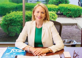 Candance Castlen Brake, President and CEO of the Greater Owensboro Chamber of Commerce sitting at her desk