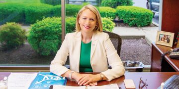 Candance Castlen Brake, President and CEO of the Greater Owensboro Chamber of Commerce sitting at her desk