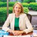 Candance Castlen Brake, President and CEO of the Greater Owensboro Chamber of Commerce sitting at her desk
