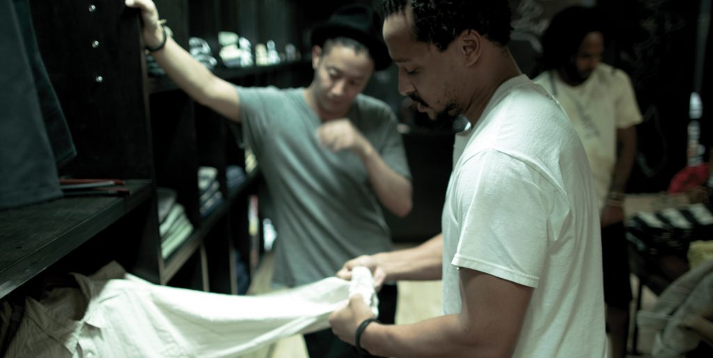 Ryan Jackson grabs a shirt in his store