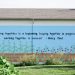 A quote by Henry Ford is painted on the side of a building at Century Christian Church.