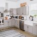 The "Fixer Upper" inspired kitchen uses gray cabinets and white walls.