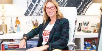 Dr. Suzanne Rashidian sitting at her desk