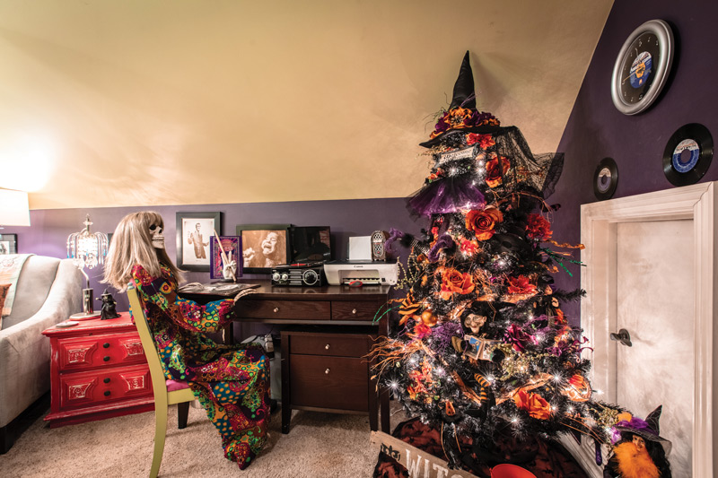 The Estes' attic decorated for Halloween with hippy skeleton and Halloween tree