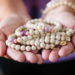 Hands holding "Erica" bracelets made by HorseFeathers Gifts