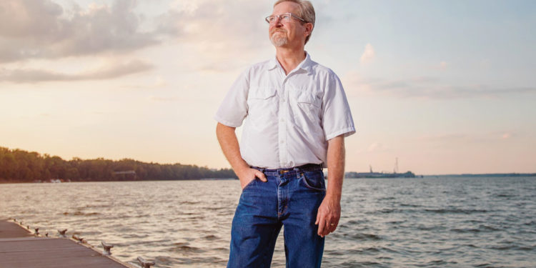 Portrait of Jeff Danhauer on pier in front of Ohio River