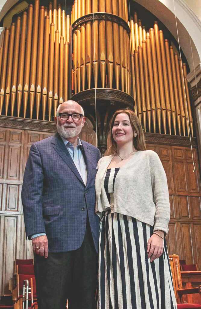 Glenn Taylor, Sr., stands with his granddaughter Lucy Jagoe Chaney inside Third Baptist Church.  //   Photo by Ryan Richardson
