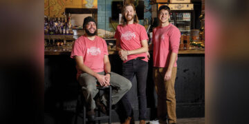 From left: Brew Bridge Head Brewer Will Gomez, Front of House Manager Ian Stafford, and Owner David Haynes // Photo by Jamie Plain